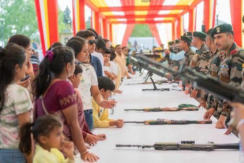 Curious visitors gaining knowledge about the Arms during Arms display by 9 grenadiers (Mewar) of Indian Army on Pratap Jayanti